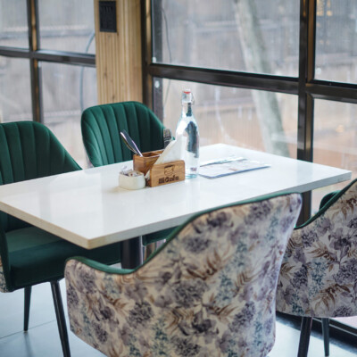 Comfort meets class — dine with a view at Hi Café Elegant seating by the window at Hi Café Goa