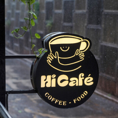 Spot the glow — Hi Café's iconic sign lights up the street Hi Café illuminated signage board outside
