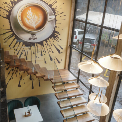 Art meets architecture — every corner tells a story Coffee splash mural and staircase inside Hi Café