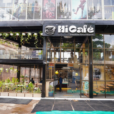 Goa’s most inviting café — from the outside in Exterior view of Hi Café with glass façade and branding